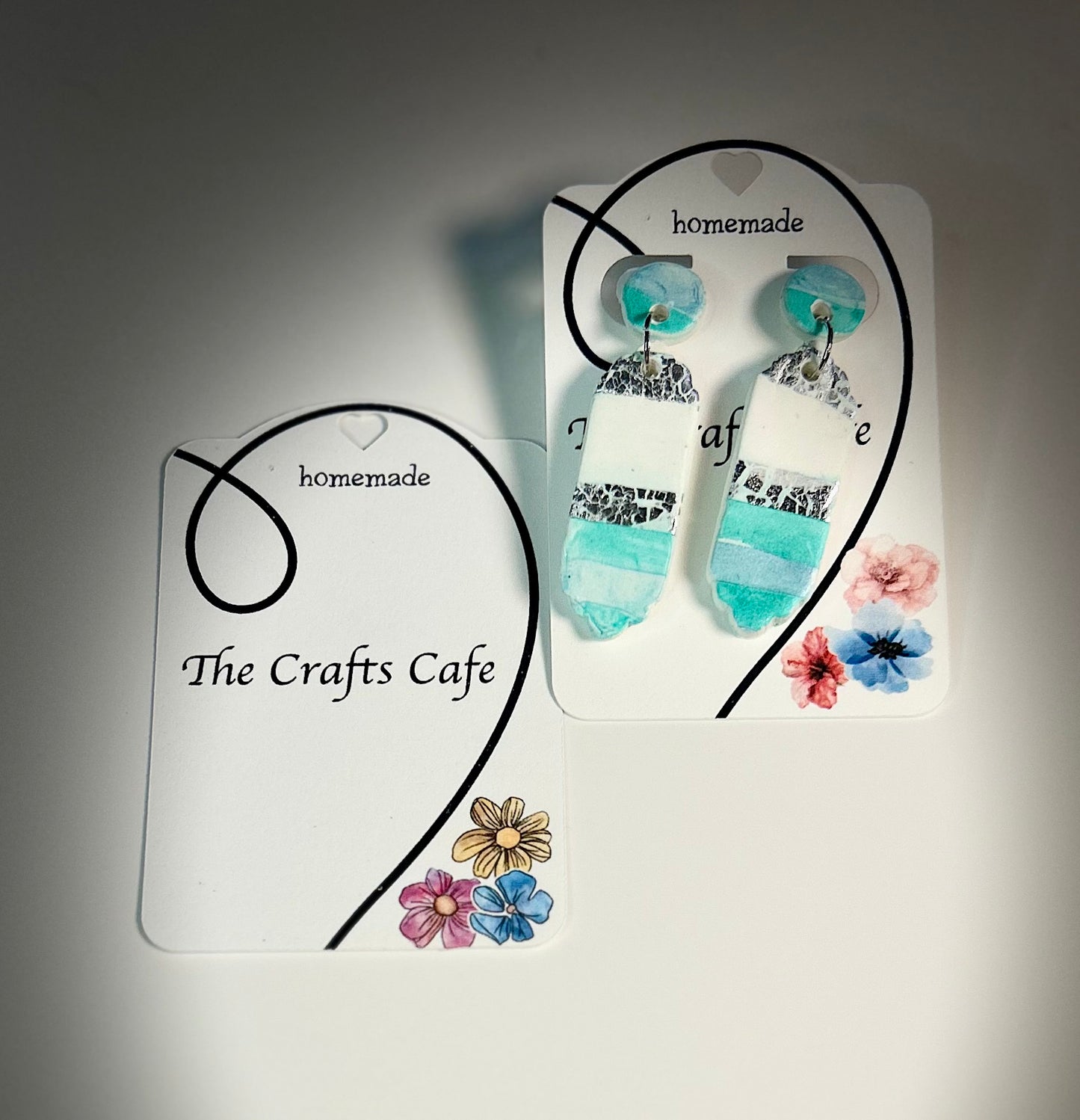 Ocean ripple shaped polymer clay earrings with silver speckles